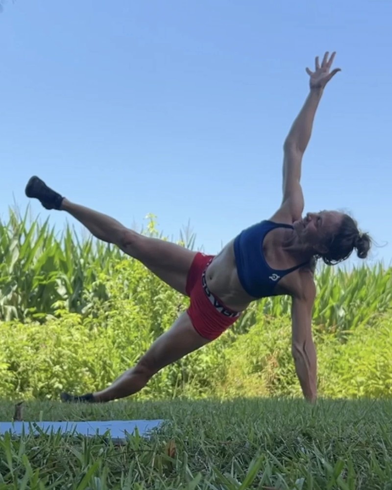 Cal in a side plank reach