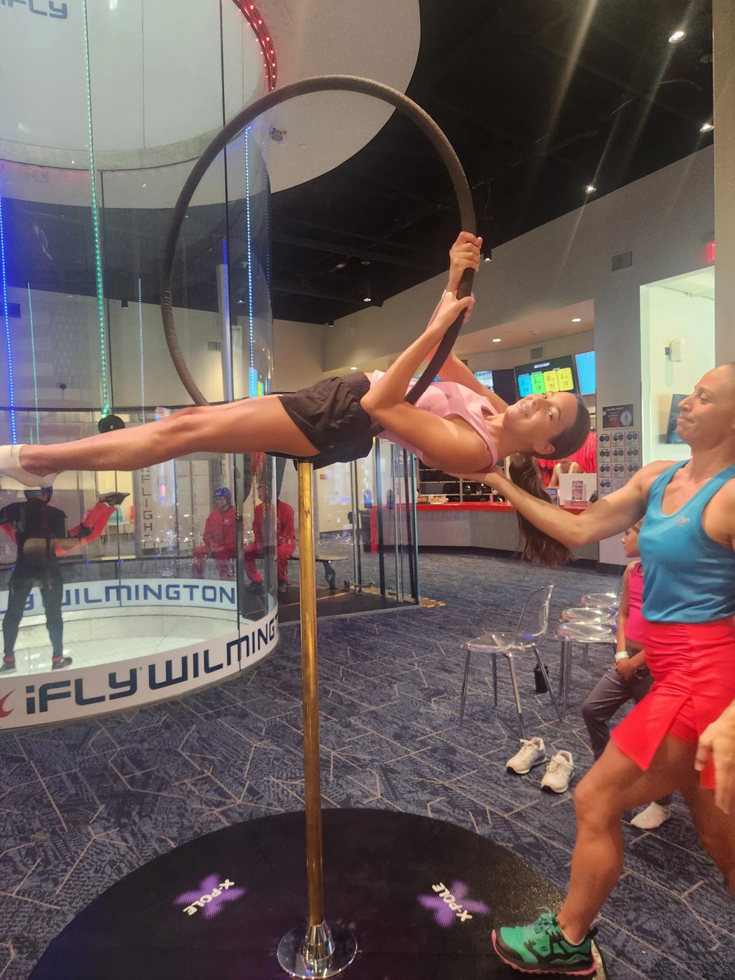 Kid training on the lyra in front of the iFLY tunnel